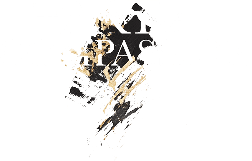 the art of compassion logo white with gold brush strokes